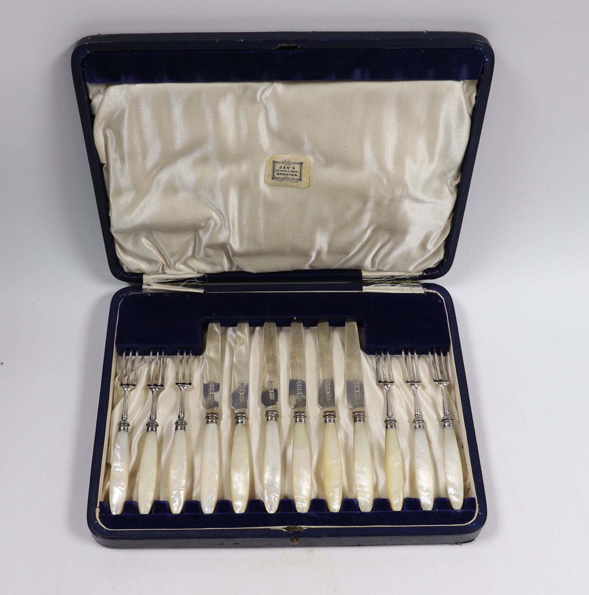 A cased set of six pairs of George V mother of pearl handled silver dessert eaters, James Dixon & Sons, Sheffield, 1921.